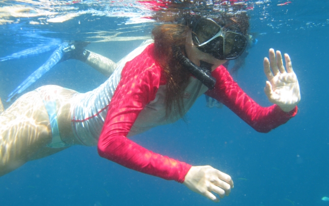 scuba-diving-girl-snorkeling-blue
